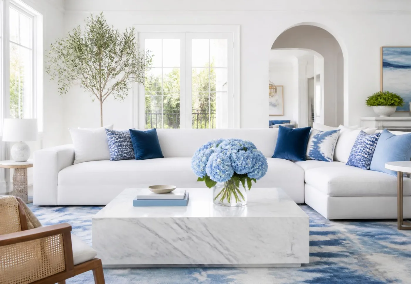 A calm, blue-toned Plymouth living room with a decorative vase on a clean side table